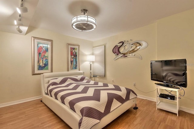 bedroom with light hardwood / wood-style floors