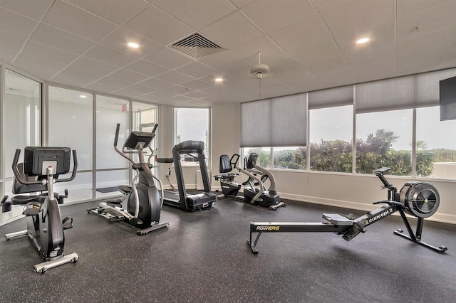 workout area featuring a drop ceiling