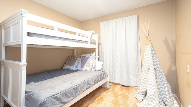 bedroom with light wood-type flooring