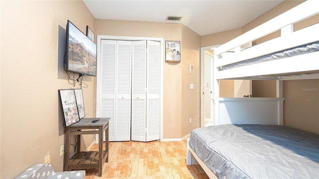 bedroom featuring a closet and light hardwood / wood-style flooring