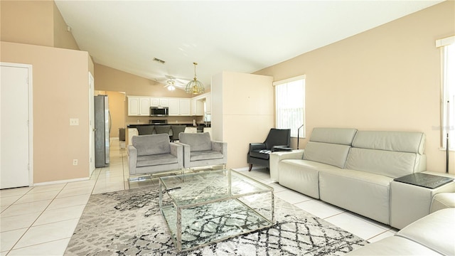 tiled living room featuring high vaulted ceiling and ceiling fan