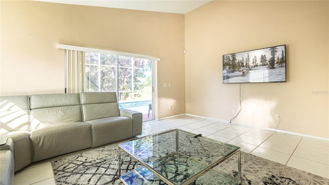 unfurnished living room with light tile patterned flooring