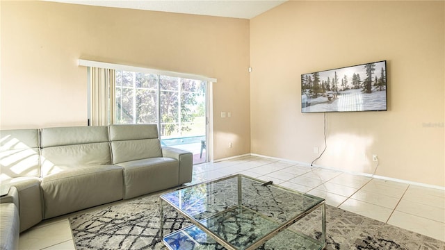 223 Lake Davenport Ests, Davenport, FL 33897 - living room with a towering ceiling, baseboards, and tile patterned floors