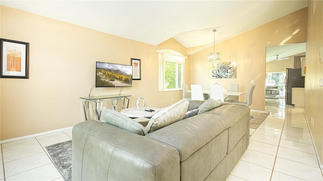 223 Lake Davenport Ests, Davenport, FL 33897 - living area with vaulted ceiling, light tile patterned floors, baseboards, and a chandelier