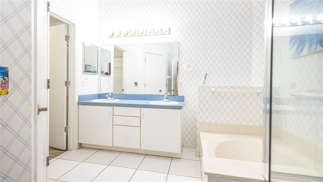 bathroom with vanity, tile patterned floors, and separate shower and tub