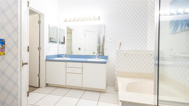 223 Lake Davenport Ests, Davenport, FL 33897 - bathroom featuring tile patterned floors, double vanity, a bath, and a shower stall