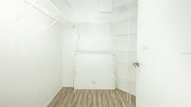 walk in closet featuring hardwood / wood-style floors