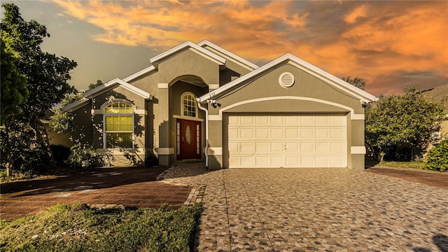 view of front of home with a garage