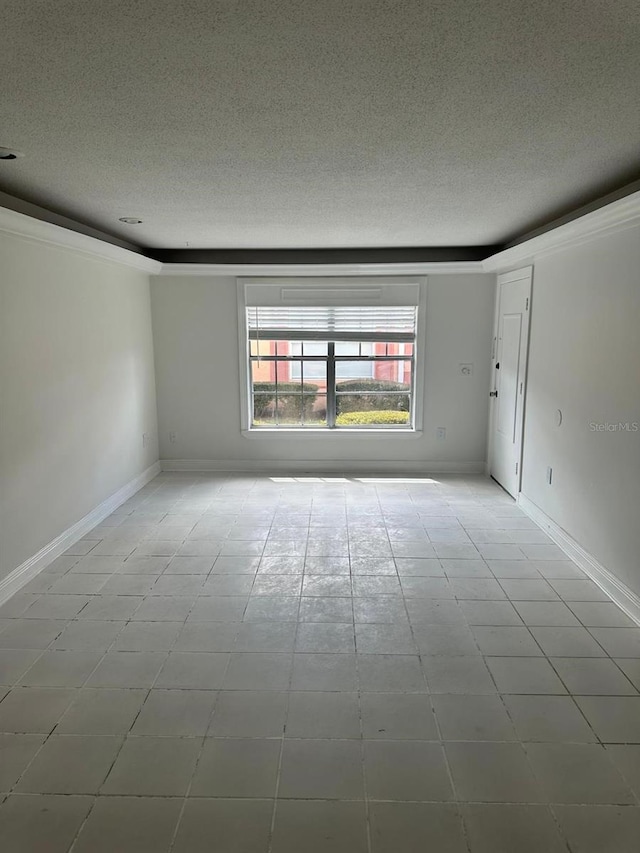 empty room featuring a textured ceiling