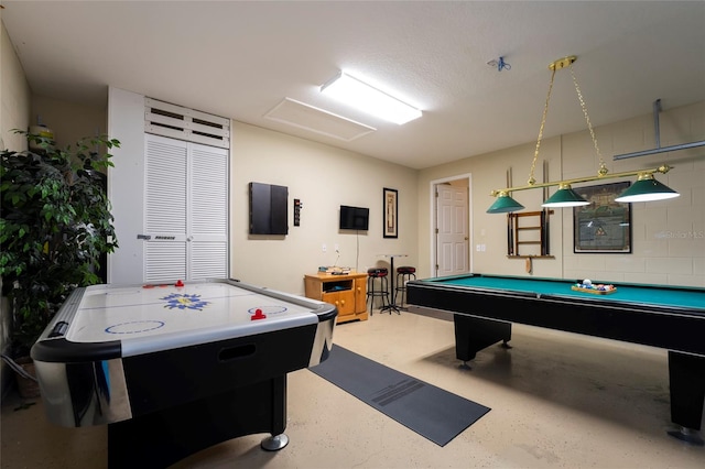 playroom with a textured ceiling