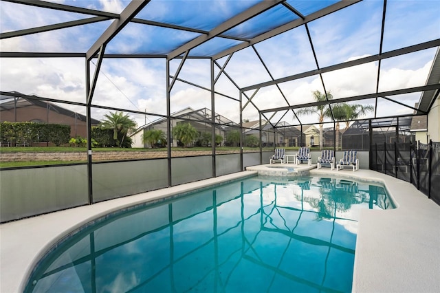 view of swimming pool featuring a water view, an in ground hot tub, a patio, and a lanai