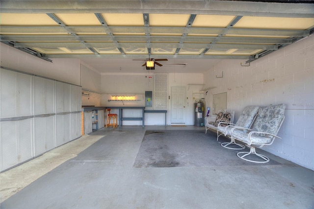 garage with a garage door opener and electric water heater