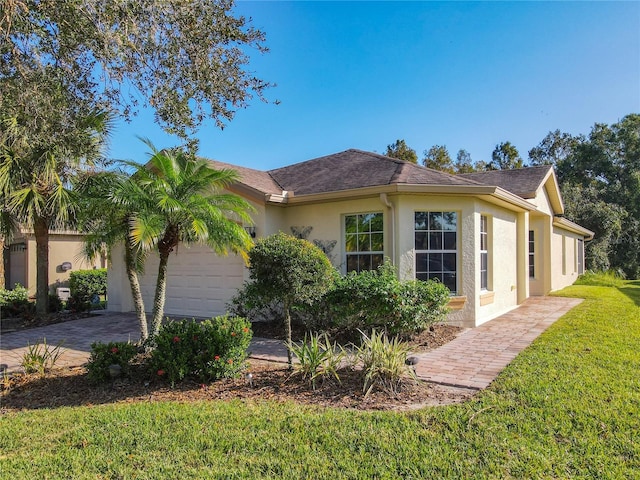 view of property exterior with a lawn and a garage