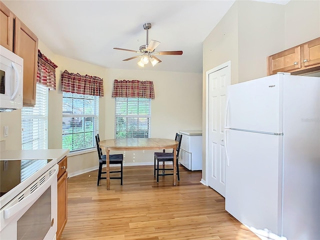 kitchen featuring light hardwood / wood-style flooring, white appliances, and ceiling fan