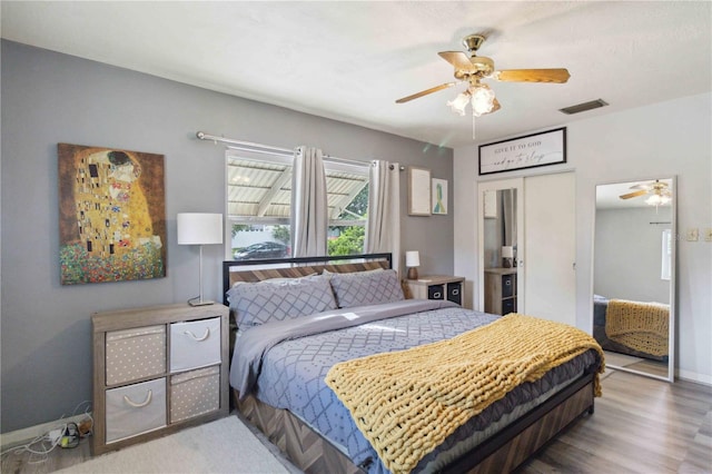 bedroom featuring ceiling fan and hardwood / wood-style floors