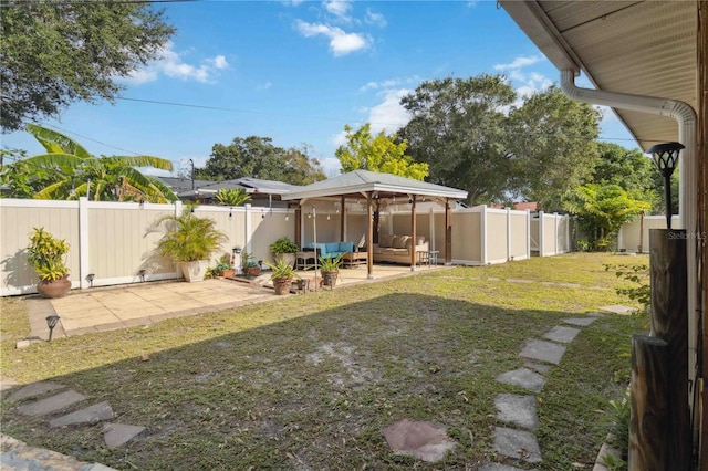 view of yard featuring a fenced backyard, a patio, and an outdoor living space