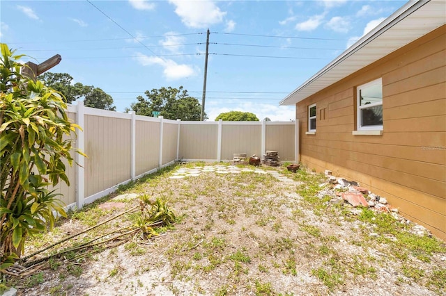 view of yard with a fenced backyard