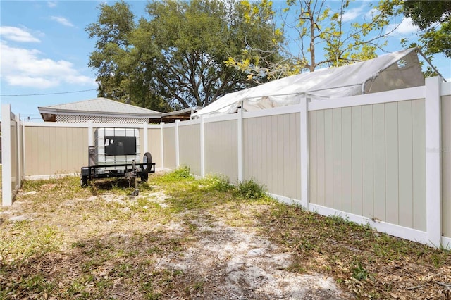 view of yard with a fenced backyard