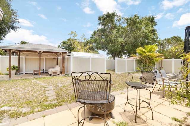 view of yard with a gazebo, a patio, and a fenced backyard