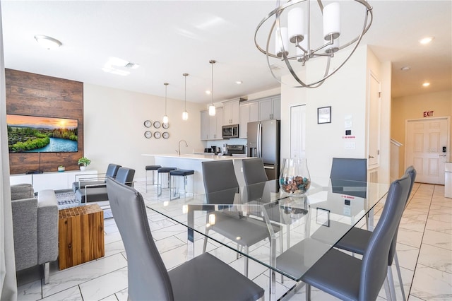 dining area with recessed lighting, an inviting chandelier, marble finish floor, and visible vents