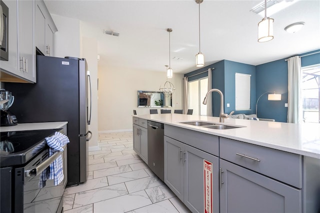 kitchen featuring stainless steel dishwasher, visible vents, marble finish floor, a sink, and gray cabinetry