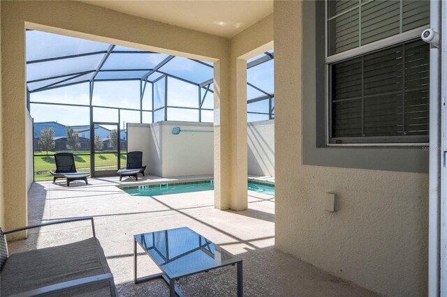 view of swimming pool with a mountain view, a patio, and a lanai