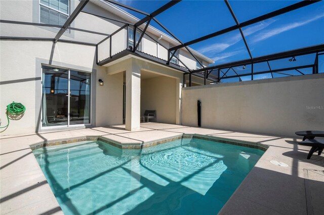 view of pool featuring a patio area and a lanai