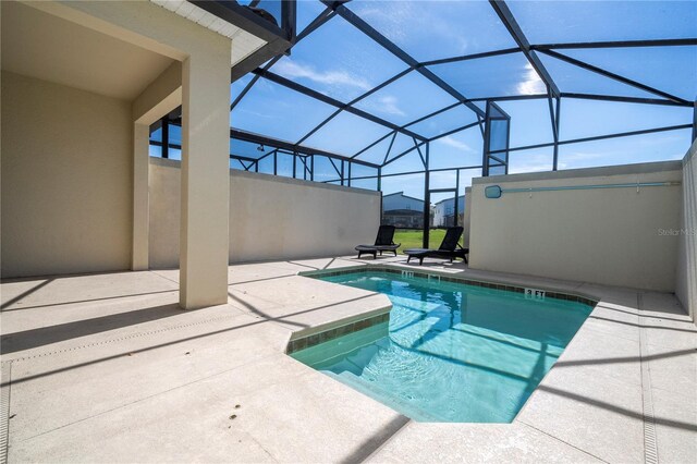 view of pool featuring a patio area and a lanai