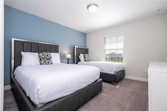 carpeted bedroom with baseboards