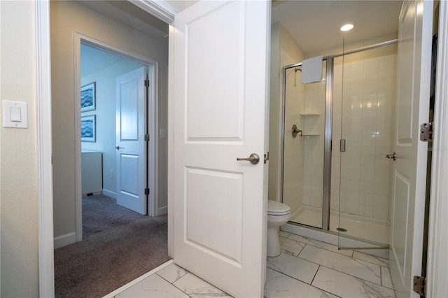 bathroom with marble finish floor, toilet, baseboards, recessed lighting, and a stall shower
