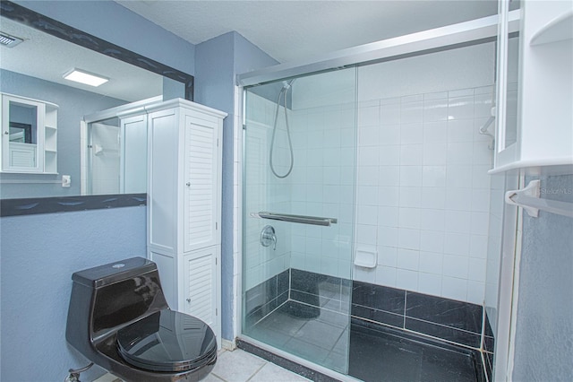 bathroom with tile patterned floors and an enclosed shower