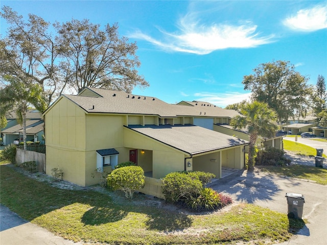 view of property exterior with a lawn