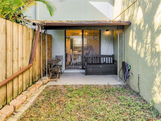 property entrance with a patio