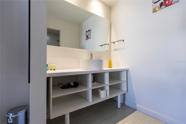 bathroom with hardwood / wood-style floors