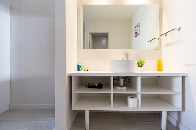 bathroom with sink and wood-type flooring