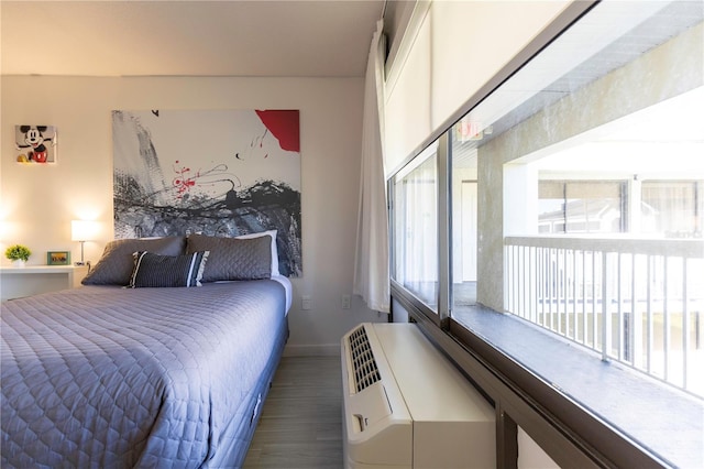 bedroom with dark wood-type flooring