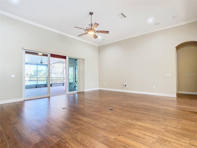 empty room featuring light hardwood / wood-style flooring, ceiling fan, and crown molding