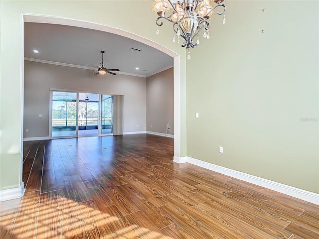 unfurnished room featuring hardwood / wood-style floors, ceiling fan with notable chandelier, and crown molding