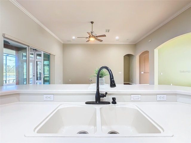 interior details with ceiling fan, crown molding, and sink