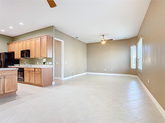 kitchen with ceiling fan, light brown cabinets, light tile patterned floors, and black appliances