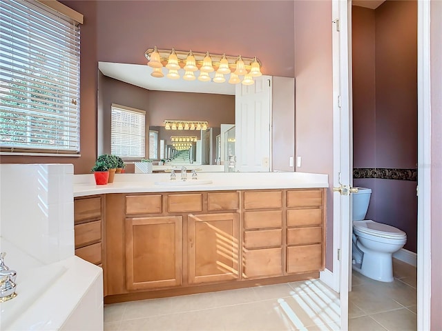 bathroom featuring tile patterned floors, vanity, and toilet