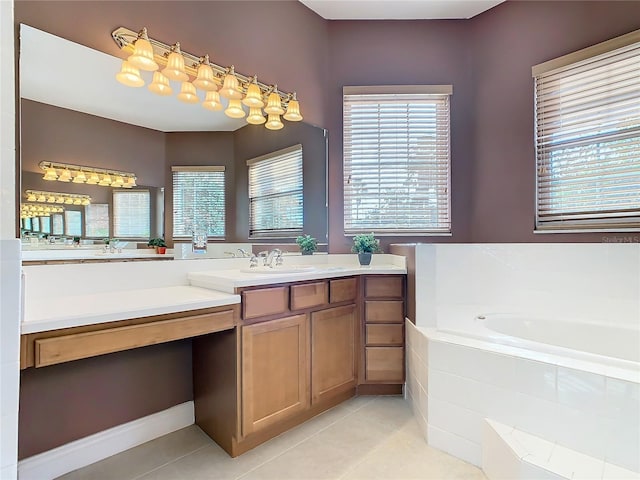 bathroom featuring tiled bath, tile patterned flooring, and vanity