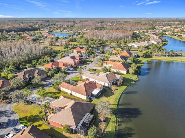 drone / aerial view with a water view