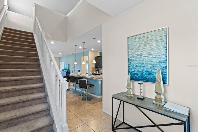 staircase with built in desk and tile patterned flooring