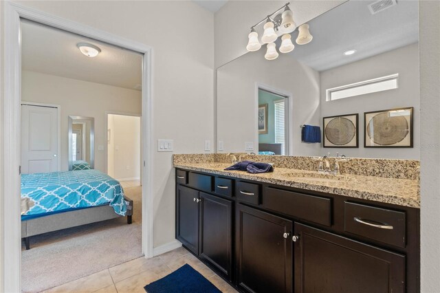 bathroom with vanity and tile patterned floors