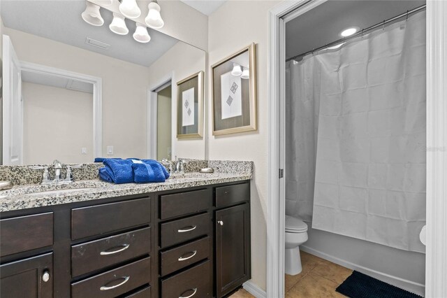 full bathroom featuring vanity, shower / bath combo, toilet, and tile patterned floors