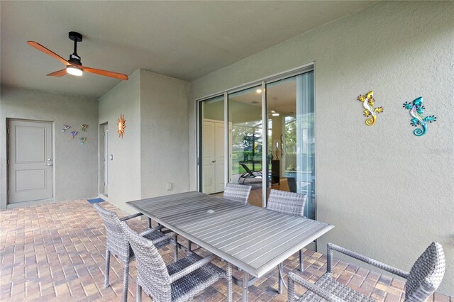 view of patio featuring ceiling fan