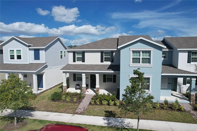 view of front of property with a front lawn and a porch