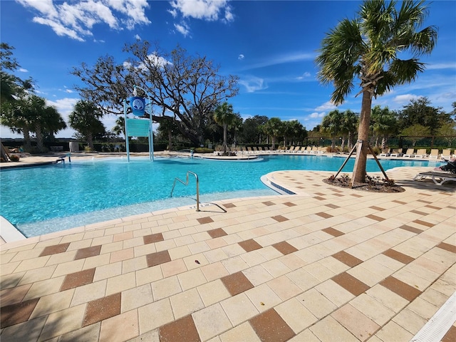 view of swimming pool with a patio