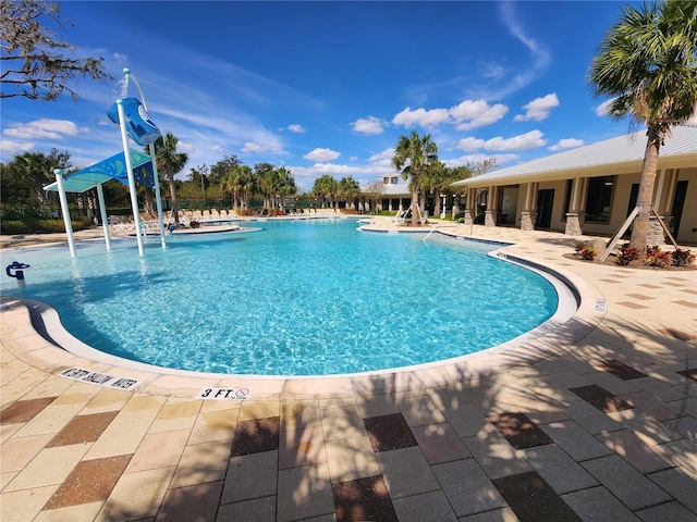 view of swimming pool featuring a patio area